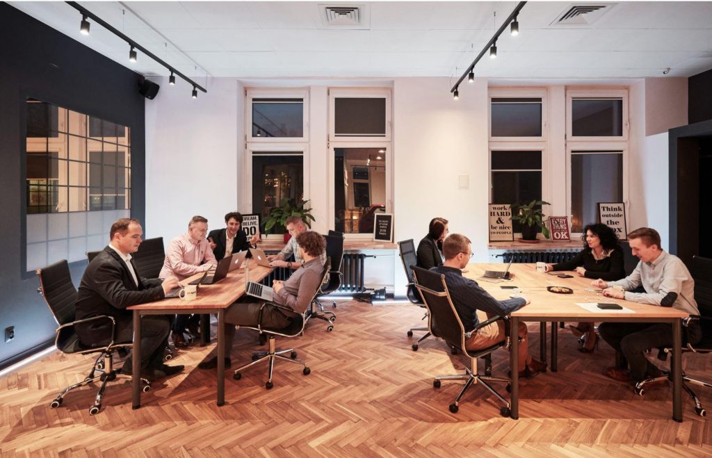 People working at their desks at CoSpot office and coworking