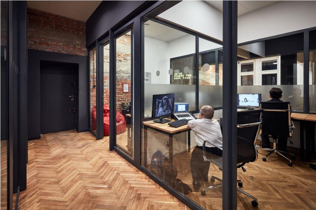 A man working inside one of the private offices at CoSpot office and coworking